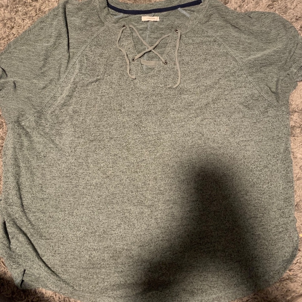 new pale green shirt with crossed strings on front